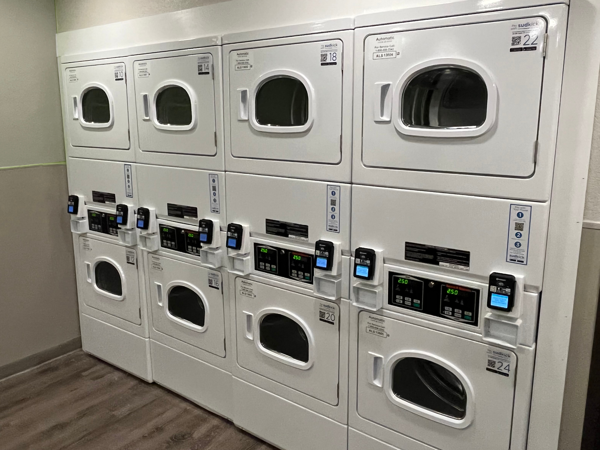 Wall of stacked laundry machines